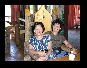 Shu Fong and Angie try out that big chair in the lobby of the Paradise Lodge. It's almost large enough for both of them.